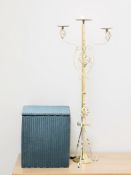 A loom basket and metal candle stand