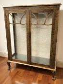 An Art Deco oak glazed door display cabinet,