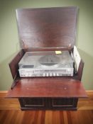 A reproduction mahogany entertainment cabinet containing a Toshiba turntable,