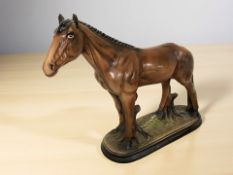 A ceramic figure of a horse,