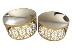 A pair of contemporary graduated gilt metal and mirror topped coffee tables,
