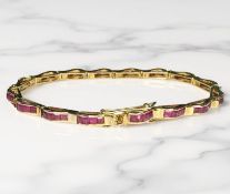 An 18ct gold ruby bracelet, length 18cm CONDITION REPORT: 12.