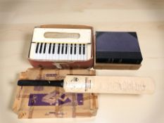 A Hohner organetta, cricket bat with New Zealand 1986 team signatures,