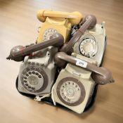 Four vintage plastic telephones