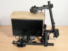 A pair of monitor stands and pc monitors