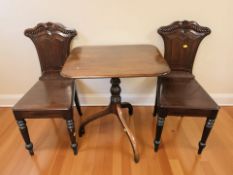 A pair of Victorian mahogany hall chairs and a tripod rectangular table