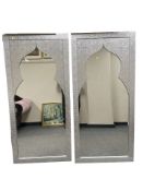 A pair of modern decorative silvered floor standing mirrors,