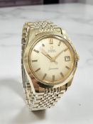 A gent's vintage gold-plated Omega Seamaster automatic centre seconds calendar wristwatch, ref.