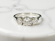 A platinum three stone diamond ring, size L, 3.7g, approximately 0.6ct.