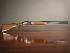 A Franchi 12 bore Falconet 451 shotgun, over under, 5032310, 27'' barrels with single trigger.