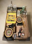 A group of alcohol miniatures, plated decanter stand, bar counter top labels,