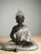 A modern silvered figure of buddha in lotus pose,