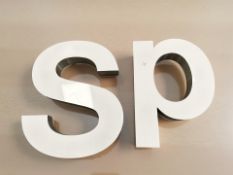 Two large metal letters 'S P',