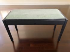 A modern ebonised piano duet stool