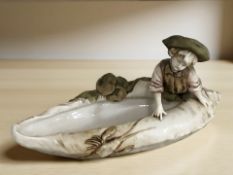 A Royal Dux porcelain bowl in the form of a boy on shell,
