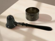 A silver candle snuff with turned wooden handle,