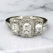 An 18ct gold three stone diamond ring, approximately 1.
