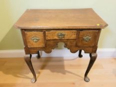 A George III oak low boy,