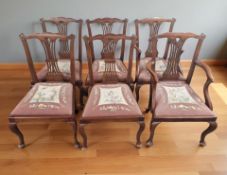 Six reproduction mahogany dining chairs with needlepoint seats