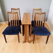 A teak oval drop leaf dining table, 160 cm x 92 cm x 95 cm,