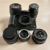 A Cannon EOS 1000F camera body together with Sigma 7-210mm lens,