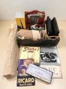 A group of reproduction signs, rug, woolen blanket,