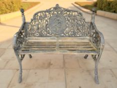 A painted cast iron two-seater garden bench,