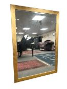 A contemporary large bevelled mirror, 194 cm x 138 cm.