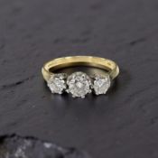 An antique 18ct gold three stone diamond ring,