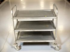 A stainless steel three tier commercial catering trolley,
