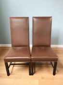 A pair of contemporary studded leather high backed chairs