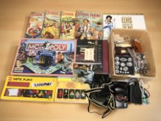 A group of children's annuals, doll's house furnishings, cameras,