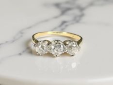 An 18ct gold three stone diamond ring, approximately 0.