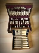 An oak canteen of Sheffield EPNS cutlery and further mahogany canteen of fish cutlery