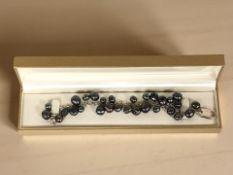 A silver and Tahitian pearl bracelet,