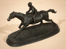 After Mene : Patinated metal figure of a jockey on horseback,