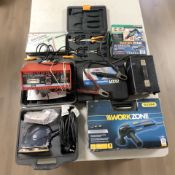 A group of hand and power tools, grinder, soldering gun,