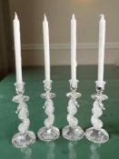A set of four Waterford crystal Seahorse candlesticks,