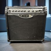 A Line 6 Spider II 15 amplifier, with lead.