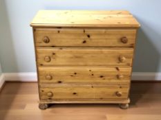 A modern pine four drawer chest, 87 cm x 47 cm x 85 cm.