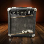 A Gorilla GG-20R reverb mini amplifier, with lead.