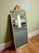 A reproduction ornate gilt mirror, height 147 cm.