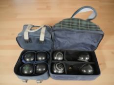 Two bags of lawn bowls.