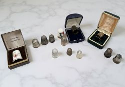 A group of silver and other thimbles