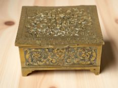 An ornate brass casket, width 11.5 cm.
