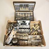 A group of cutlery sets and canteens, plated wares.
