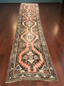 An antique Karabagh runner, South Caucasus, 420 cm x 103 cm.
