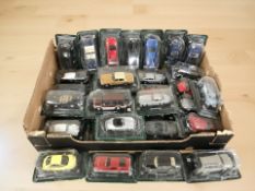 A collection of 1:43 scale die cast model cars in packaging.