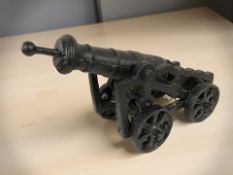 A cast iron miniature cannon, length 40 cm.