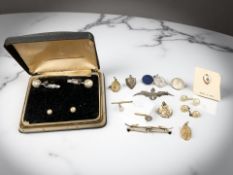 A silver RAF sweetheart brooch, a Victorian locket, religious pendants,
